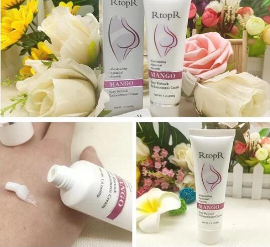 RtopR Mango Buttocks Enhancement Cream tubes by Elixir-369; ZENDROP lotion, white Mango-labeled tubes (3) amid flowers
